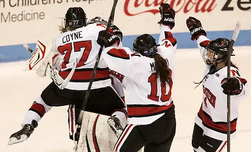 Kendall Coyne, 2013 Beanpot MVP, leaps onto Chloe Desjardins as the Beanpot final ended. (2013 Melissa Wade)