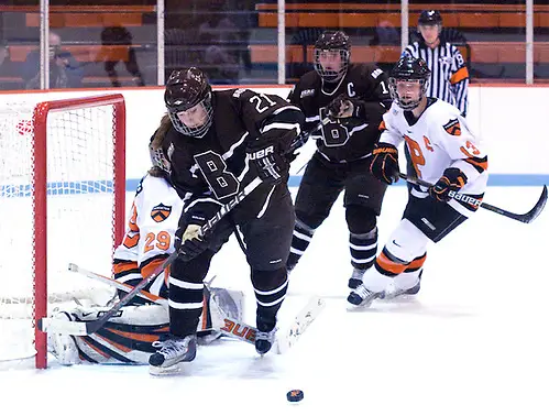 Jessica Hoyle (Brown - 21) goes after a rebound in front of goaltender Rachel Webber (Princeton - 29), as Laura Martindale (Princeton - 13) battles for position with Jenna Dancewicz (Brown - 14). (Shelley M. Szwast)