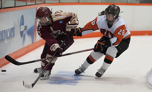 2012/03/17 - RIT's Kourtney Kunichika is defended by Norwich's Marie-Philip Guay during the NCAA Division-3 National Championship game in Rochester, N.Y. on March 17th, 2011. RIT defeated Norwich 4-1. (Mike Bradley)