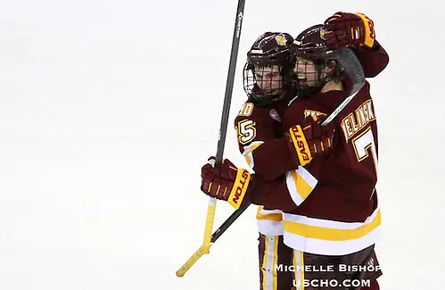 Minnesota Duluth's Andy Welinski (7) celebrates his third period goal with Justin Crandall. Minnesota Duluth beat Nebraska-Omaha 3-2 at the CenturyLink Center in Omaha on Friday. (Photo by Michelle Bishop) (Michelle Bishop)