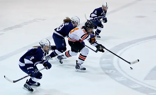 Photo By: Shelley M. Szwast Fiona McKenna (Princeton - 24) plays the puck as Amy Petersen (Penn State - 9), Laura Bowman (Penn State - 18), and Micayla Catanzariti (Penn State - 10) give chase. (Shelley M. Szwast)