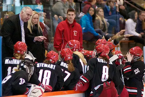 Photo By: 2012 Omar Phillips Plattsburgh coach Kevin Houle talks to his players during a stoppage of play (2012 Omar Phillips)