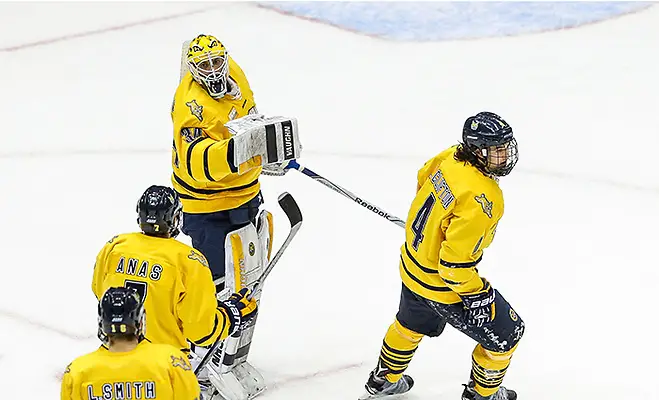 March 18, 2016:  Quinnipiac Bobcats goalie Michael Garteig (34) celebrates goal with teammates after goal by Quinnipiac Bobcats defenseman Connor Clifton (4) during 2016 ECAC Tournament Semifinal game between Dartmouth University and Quinnipiac University at Herb Brooks Arena in Lake Placid, NY. (John Crouch/J. Alexander Imaging)