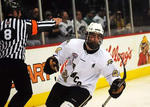Photo By: Jordan Doffing Shane Berschbach skates to his teammates after tying the game 2-2 with Denver. (Jordan Doffing)