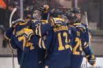 Canisius players celebrate a third period goal in a 3-1 win at RIT (Omar Phillips)