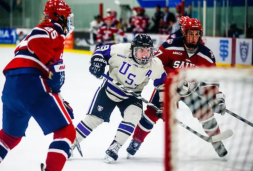 Thomas Williams works around the net during a men's hockey game against Saint Mary's University January 9, 2016 at St. Thomas Ice Arena. The Tommies  beat the Cardinals 6-2. (Mike Ekern/University of St. Thomas)