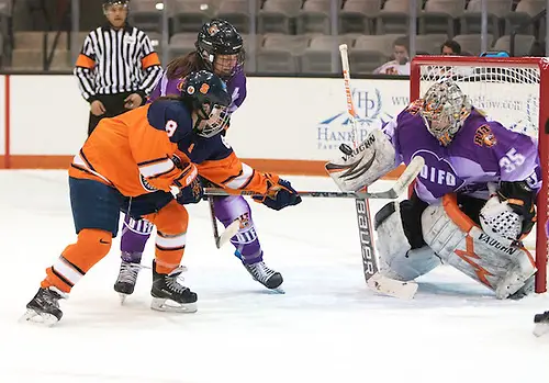 Photo By: Omar Phillips Jetta Rackleff (35 - RIT) makes one of her 41 saves in front of Stephanie Grossi (8 - Syracuse) and Carly Payerl (17 - RIT) (Omar Phillips)