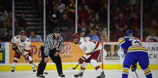 Jaakko Heikkinen of Denver readies for a faceoff. Denver vs. Lake Superior at Magness Arena, 10/20/2017. (Candace Horgan)