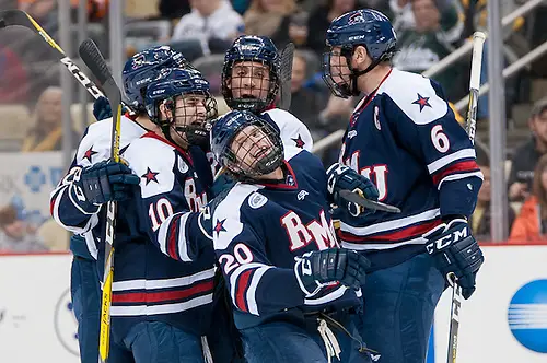 Photo By: Omar Phillips Robert Morris players celebrate a goal by Timmy Moore (20 - Robert Morris) (Omar Phillips)