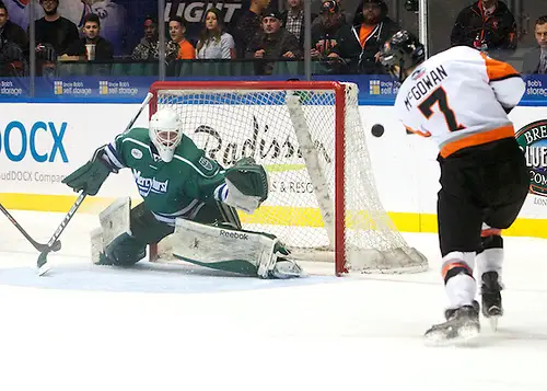 A Brad McGowan (7 - RIT) shot sails just wide of Brandon Wildung (1 - Mercyhurst) (Omar Phillips)