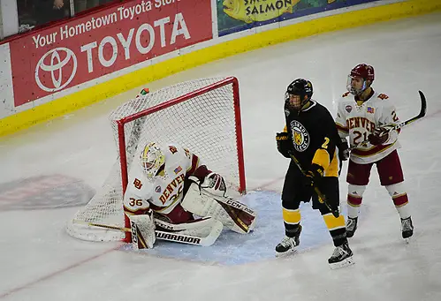 Tanner Jaillet of Denver and Michael Davies of Denver defend CC's Trevor Gooch. Tanner Jaillet of Denver and Michael Davies of Denver defend CC's Trevor Gooch. Colorado College at Denver, Magness Arena, 12/08/17. (Candace Horgan)