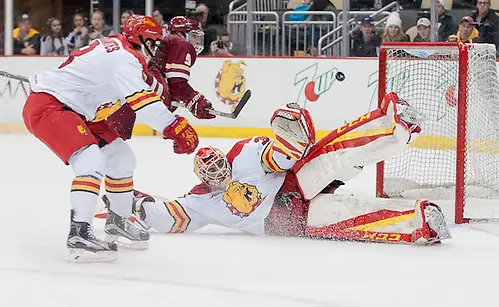 Justin Kapelmaster (35 - Ferris State) stacks the pads as a shot by Austin Cangelosi (9 - Boston College) sails just wide (Omar Phillips)