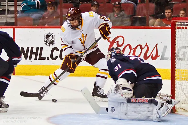 2016Jan10: Ryan Belonger (ASU - 16), Rob Nichols (UConn - 31). The UConn Huskies shut out the Arizona State Sun Devils 3-0 in the Consolation Game of the inaugural Desert Hockey Classic at Gila River 2016Jan10: Ryan Belonger (ASU - 16), Rob Nichols (UConn - 31). The UConn Huskies shut out the Arizona State Sun Devils 3-0 in the Consolation Game of the inaugural Desert Hockey Classic at Gila River Arena in Glendale, AZ. (©Rachel Lewis)