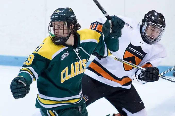 Aaron Kesselman (Princeton - 11) and Brett Gervais (Clarkson - 19) collide at the blue line. (Shelley M. Szwast)