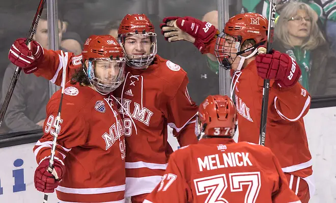 Anthony Louis (Miami of Ohio-95) Carson Meyer (Miami of Ohio-18) Josh Melnick (Miami of Ohio-37) 17 Jan.14 Miami of Ohio Redhawks and University of North Dakota meet in a NCHC conference match-up at the Engelsted Arena Grand Forks, ND (Bradley K. Olson)