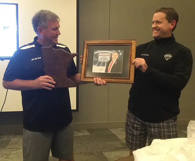 Don Adam (right) presents the Mark Rudolph Award to Ron Foyt. (photo: NCHC)