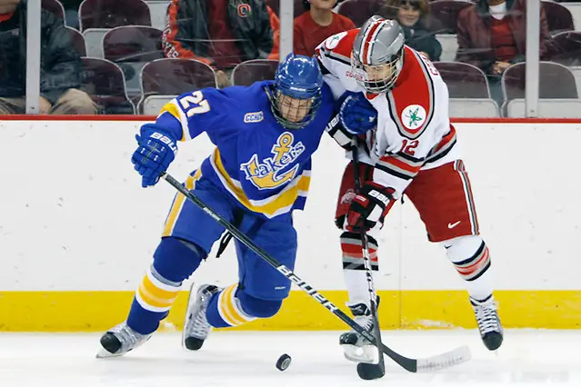 2 Dec 11: Matt Bruneteau (LSSU - 27), Travis Statchuk (OSU - 12) Ohio State beats Lake Superior State at Value City Arena in Columbus, OH. (©Rachel Lewis)