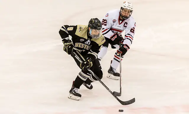 Dawson DiPietro (Western Michigan-9)) Jimmy Schuldt (SCSU-22) 2018 Jan. 12 The St.Cloud State University Huskies host Western Michigan in a NCHC matchup at the Herb Brooks National Hockey Center in St. Cloud, MN (Bradley K. Olson)