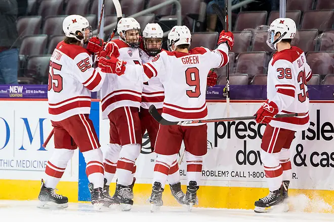 Miami players celebrate an early first period goal by Karch Bachman (85 - Miami) (2018 Omar Phillips)