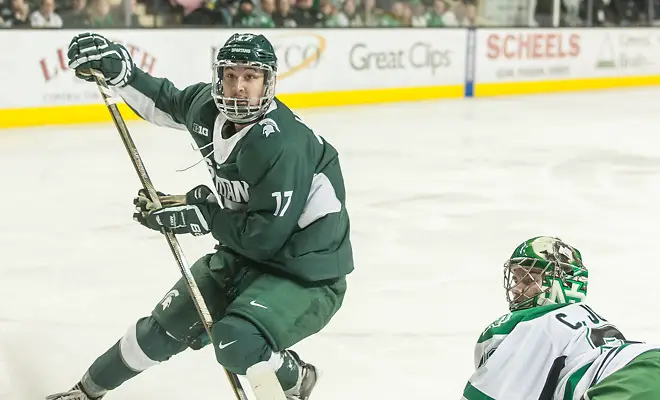 Photo By: Bradley K. Olson Taro Hirose (Michigan State-17) Cam Johnson (North Dakota-33) 16 November 26 Michigan State University and University of North Dakota meet in a non conference contest at Ralph Engelstad Arena (Bradley K. Olson)