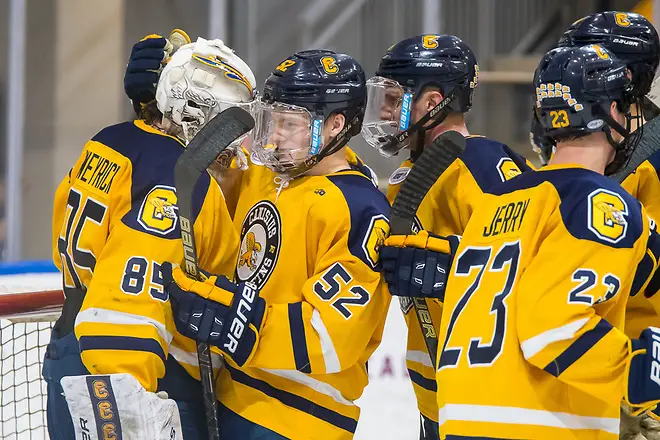 Photo By: 2019 Omar Phillips Blake Wareham (52 - Canisius) congratulates Blake Weyrick (85 - Canisius) after a 3-1 win over North Dakota (2019 Omar Phillips)