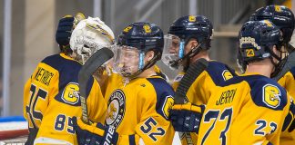 Blake Wareham (52 - Canisius) congratulates Blake Weyrick (85 - Canisius) after a 3-1 win over North Dakota (2019 Omar Phillips)