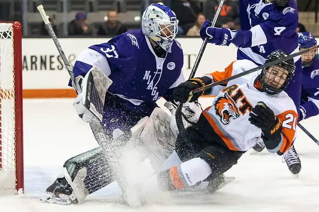 Alden Dupuis (21 - RIT) crashes into Brian Wilson (33 - Niagara University) (2019 Omar Phillips)