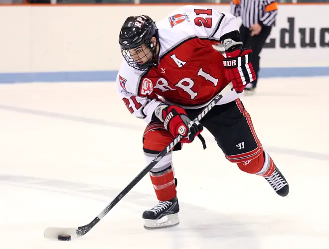 Chase Polacek (RPI - 21) carries the puck through the neutral zone. The Rennselaer Engineers visited Princeton's Hobey Baker Rink, defeating the Princeton Tigers 5-2. (Shelley M. Szwast)