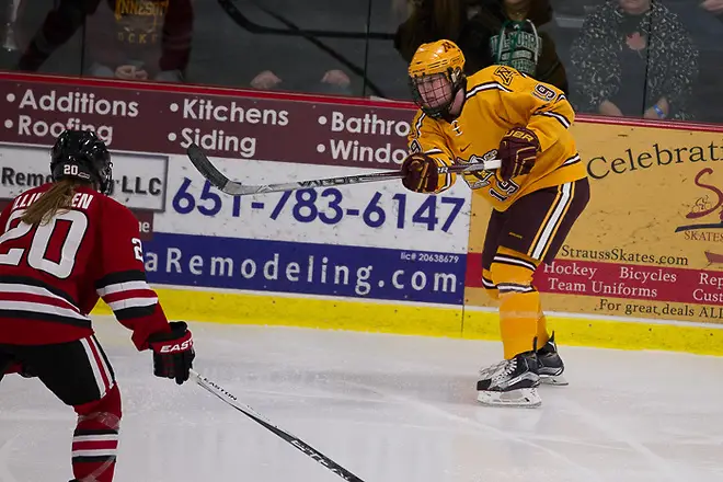 11 Dec 15: Suvi Ollikainan (St. Cloud -20), Kelly Pannek (Minnesota - 19). The University of Minnesota Golden Gophers play against the St. Cloud State University Huskies in the U.S. Hockey Hall of Fame Game at the Roseville Skating Center in Roseville, MN. (Jim Rosvold)