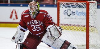 March 19, 2016: Harvard Crimson goalie Michael Lackey (35) takes shots during warmups prior to the 2016 ECAC Tournament Championship game between Harvard University and Quinnipiac University at Herb Brooks Arena in Lake Placid, NY. (John Crouch/J. Alexander Imaging)