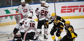 29 Mar 19: The St. Cloud State Huskies play against the American International Yellow Jackets in a 2019 West Regional semifinal matchup at Scheels Arena in Fargo, ND. (Jim Rosvold)