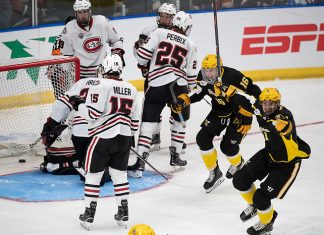 29 Mar 19: The St. Cloud State Huskies play against the American International Yellow Jackets in a 2019 West Regional semifinal matchup at Scheels Arena in Fargo, ND. (Jim Rosvold)