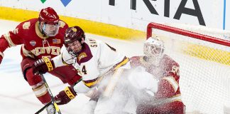 Dylan Samberg ( Minnesota-Duluth-4) Filip Larsson (Denver-30) 2019 March 22 Denver and University of Minnesota Duluth meet in the semi finals of the NCHC Frozen Face Off at the Xcel Energy Center in St. Paul, MN (Bradley K. Olson)