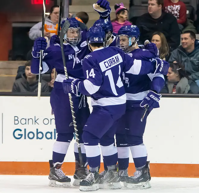 Niagara players celebrate a third period goal (2019 Omar Phillips)