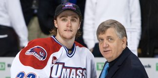 Scott Wilson (UML - 23) poses with his all tournament award and Joe Bertagna. - The University of Massachusetts Lowell River Hawks defeated the Boston University Terriers 1-0 to win the 2013 Hockey East championship on Saturday, March 23, 2013, at TD Garden in Boston, Massachusetts. (Melissa Wade)