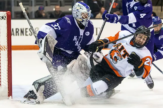 Photo By: 2019 Omar Phillips Alden Dupuis (21 - RIT) crashes into Brian Wilson (33 - Niagara University) (2019 Omar Phillips)