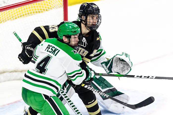 Andrew Peski (North Dakota-4) Paul Washe (Western Michigan-23) 2020 February 29 Western Michigan and the University of North Dakota meet in a NCHC contest in Grand Forks, ND (Bradley K. Olson)